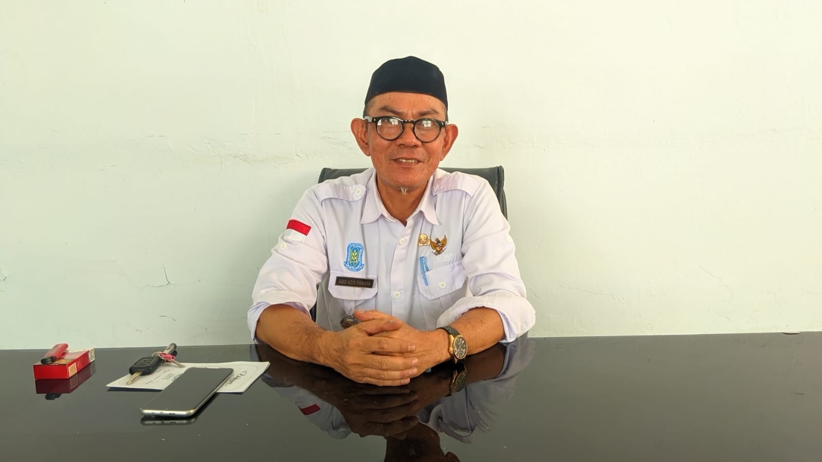Camat Tibawa, Abd Azis Pakaya usai diwawancarai, foto/aiimnews.com/ Herman Abdullah
