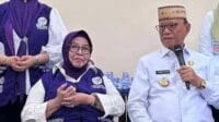 Ketua Tim Penggerak PKK, Hj. Ruwaida Mile didampingi Bupati Bone Bolango, Ismet Mile, foto/Istimewa